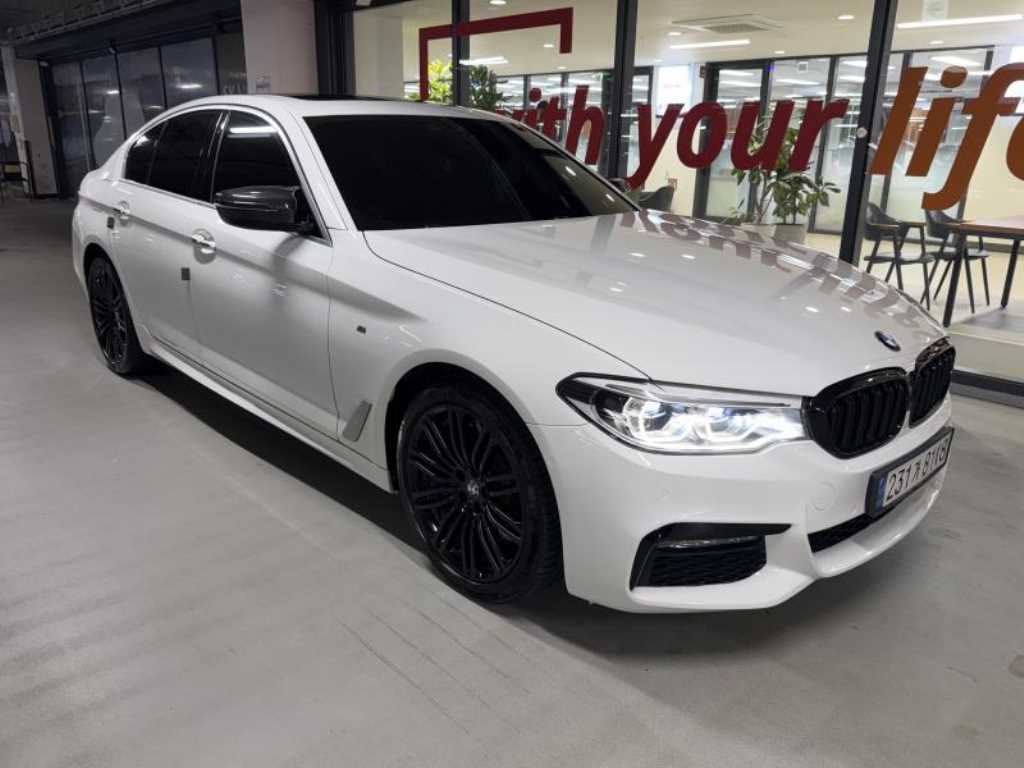 BMW 5-Series — photo 01